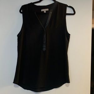 Sleeveless blouse with faux leather trim